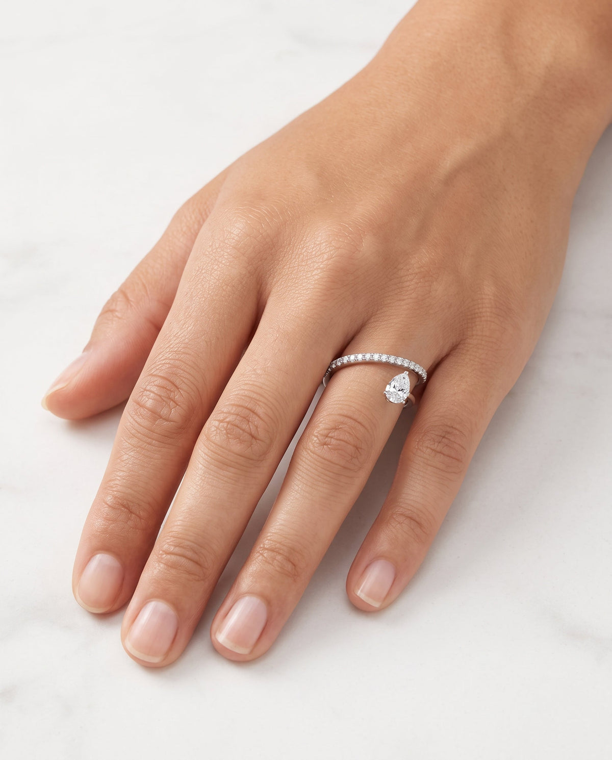Hidden Orbit pear diamond wrap ring in 18K white gold – view 4