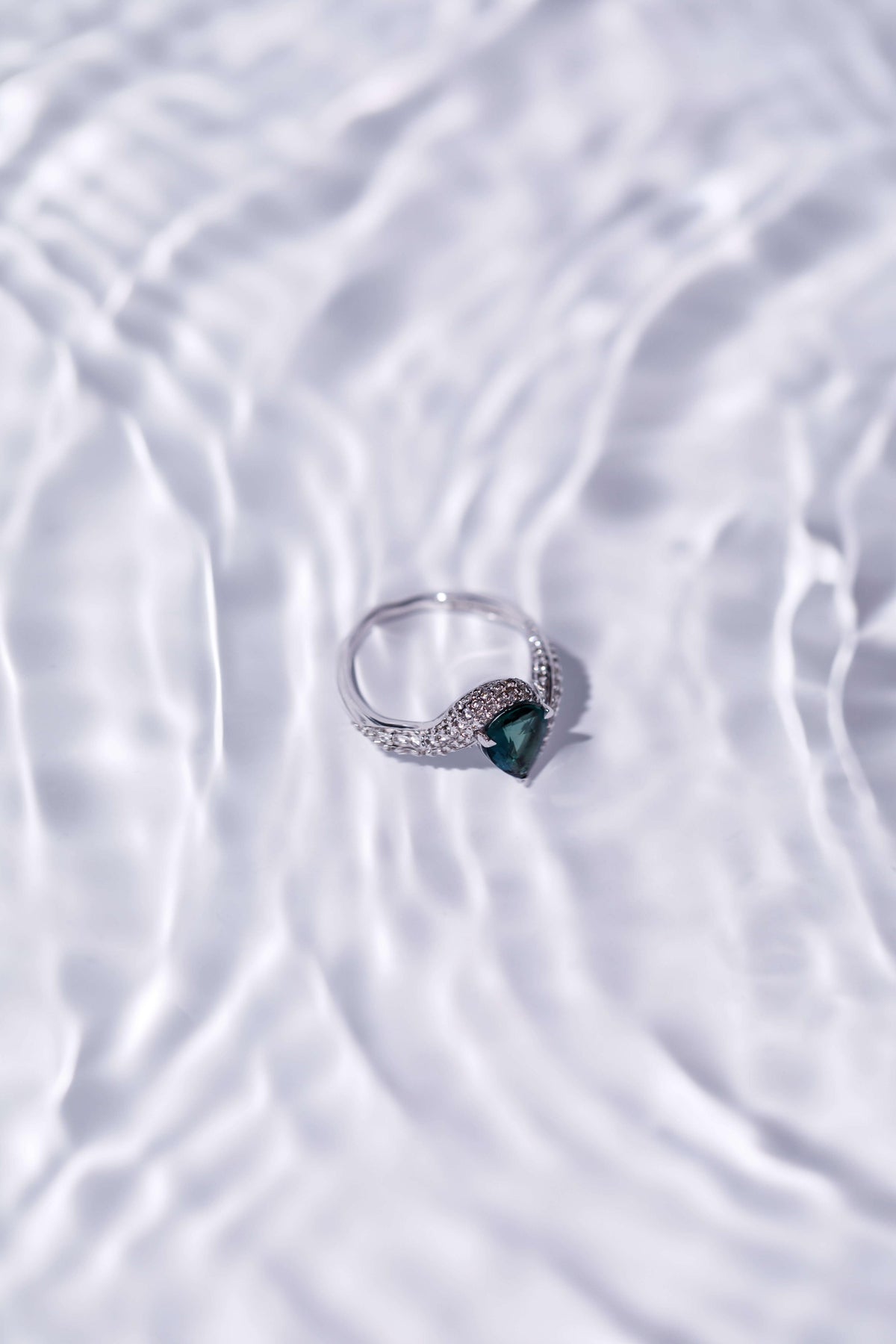 A ring resting in rippling water