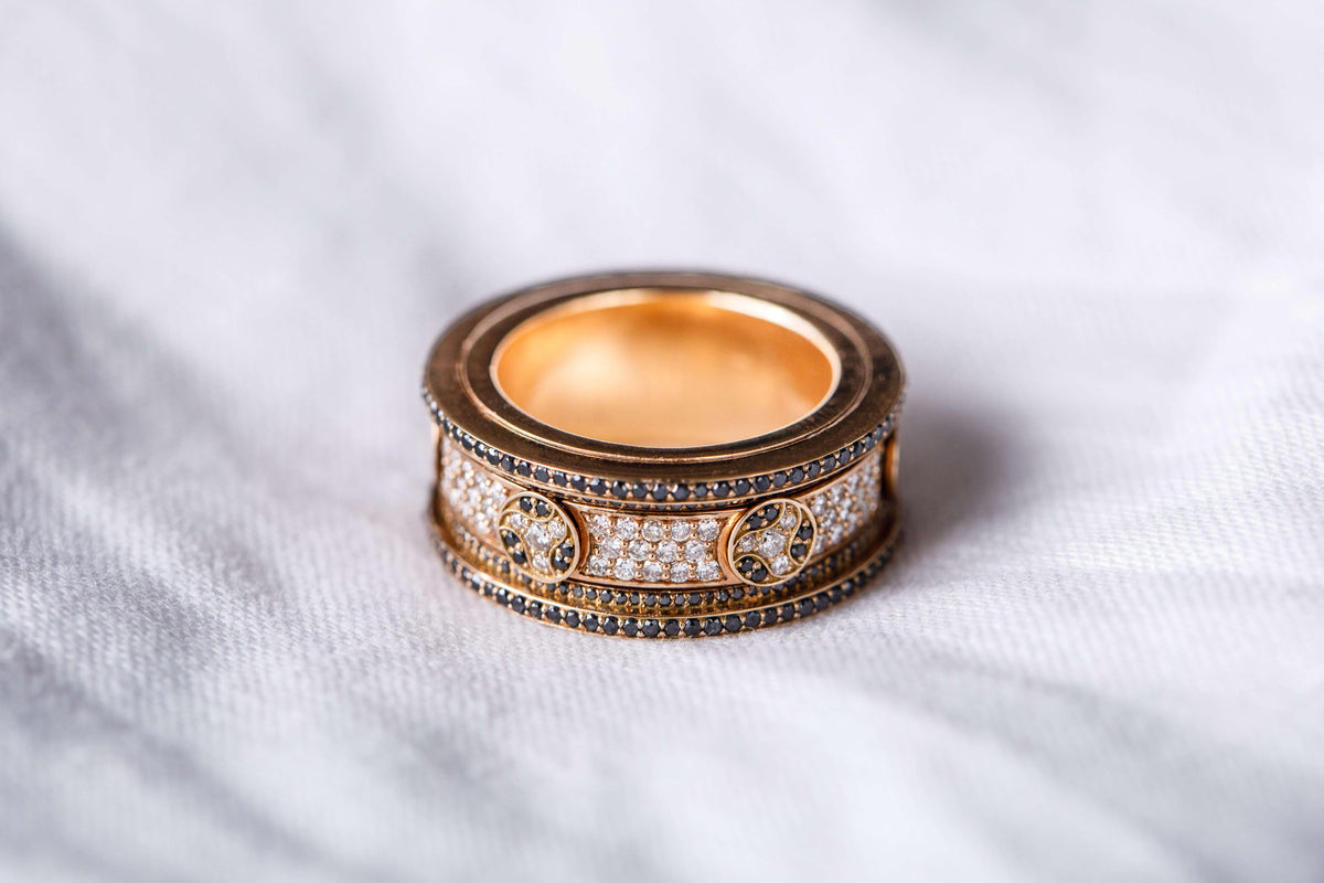 An 18K gold and diamond ring from The Essentials on a limestone block